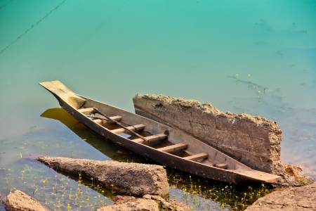 The old wooden boat in the riverの写真素材