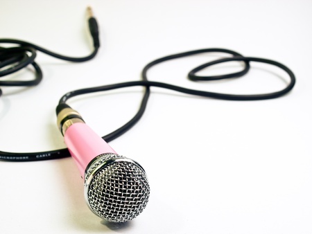 pink microphone on white backgroundの写真素材