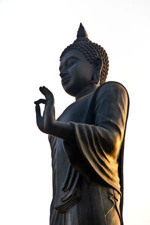 Silhouette of stand buddha statue, Thailandの写真素材