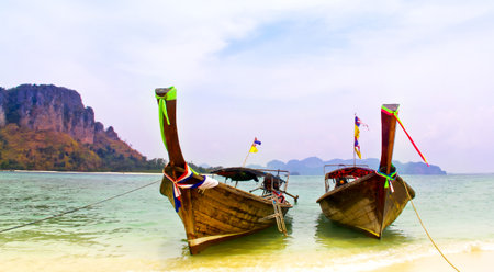 Tropical beach,traditional long tail boats at Phi-Phi island,Krabi,Thailandの写真素材