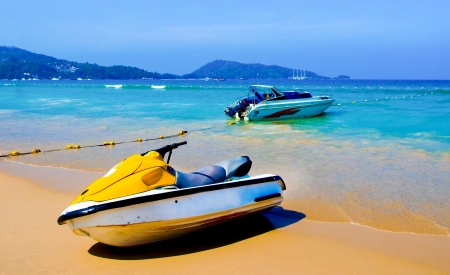 scouter boats onTropical beachl at Phuket island Thailandの写真素材