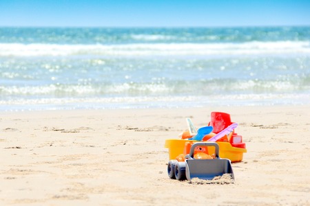 a bucket and sand toys for the children play time either on vacation, at the beachの写真素材