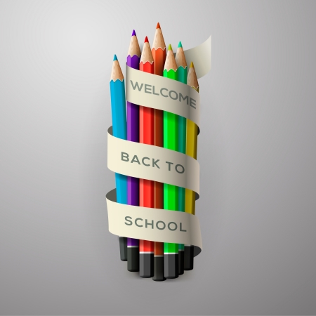 Colorful pencil crayons with text Back to school on ribbonの写真素材