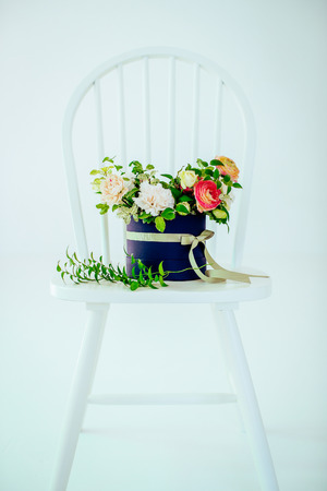 Flower decor over a white chair.の写真素材