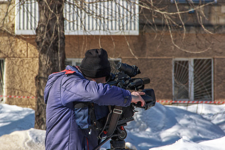 Professional operator with a video camera at work.  Tv reportage