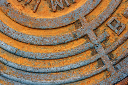 Fragment of an old rusty sewer hatch as a background or texture. Manhole cover.の写真素材