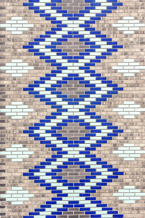 Wall of decorative colored ceramic bricks. Geometric pattern, mosaic. Backgroundの写真素材