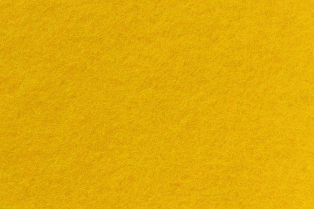 Surface of felt close-up. Yellow background, seamless texture.の写真素材