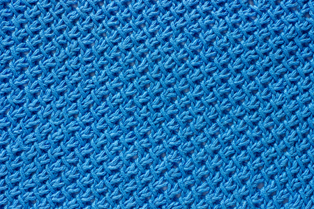 Texture patterned knit fabric. Knitting yarn handmade.
