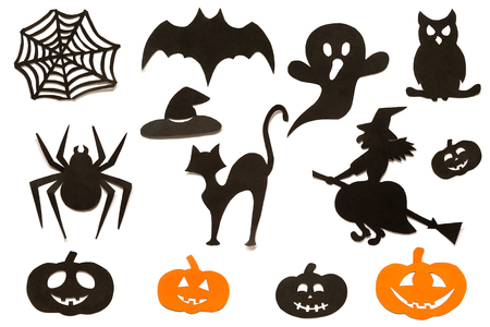 Happy Halloween Set cut out of black orange paper silhouettes pumpkin, witch, ghost, cat, owl, spider, web, hat, bat, castle isolated on white background. Concept Paper cut style. Top viewの写真素材