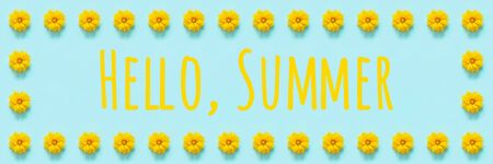 Text Hello summer. Flower composition. Floral frame border of yellow flowers Coreopsis on blue background. Template for your design Top view Flat Lay Banner.の写真素材
