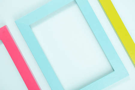 Creative layout made of bright colored frames on blue background. Flat lay Top view Copy space.の写真素材