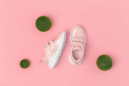 Sports shoes, sneakers on pink background. Sport lifestyle concept Top view Flat lay Copy space.の写真素材