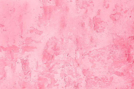 Trendy color of the year 2023. Surface of old shabby wall with falling off plaster, toned in viva magenta color as background or texture.の写真素材