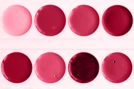 Trendy color of the year 2023. Palette watercolor paints and brush toned in viva magenta colorの写真素材
