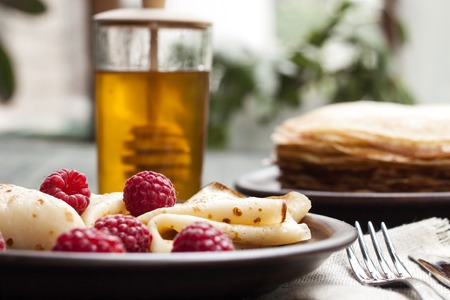 delicious pancakes on wooden table with fruitsの写真素材