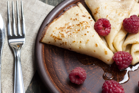 delicious pancakes on wooden table with fruitsの写真素材