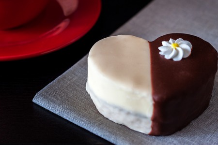 Chocolate covered biscuit in the shape of a heartの写真素材