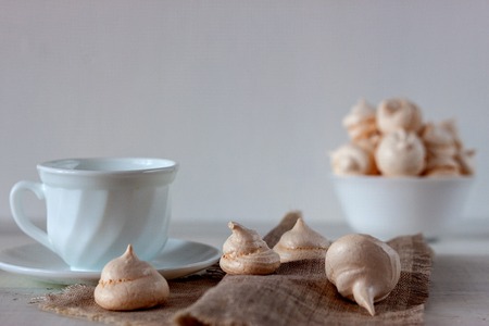 On the white wooden table is a cup with bizetの写真素材