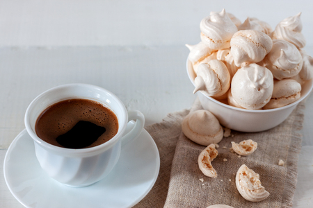 On the white wooden table is a cup with bizetの写真素材