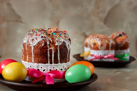 Traditional Orthodox Christian Easter food. Easter cake and painted eggs on the table.