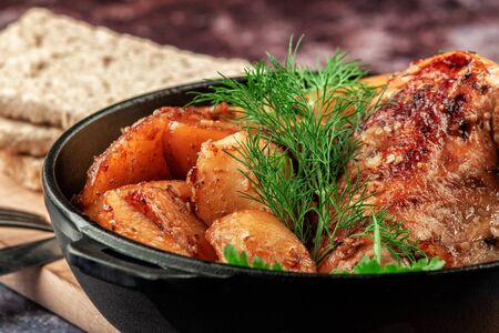 Oven-baked chicken with vegetables and herbs. Home made food. Concept for a tasty and hearty meal.の写真素材