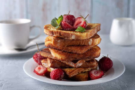 French toast with cinnamon, strawberries and mint for coffee or tea. Morning breakfastの写真素材