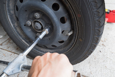 Use the lug wrench,  the tireの写真素材