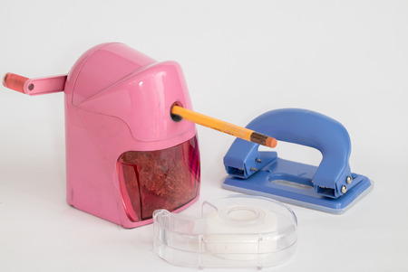 pencil sharpener and Scotch tape and Hole puncher isolated with white backgroundの写真素材