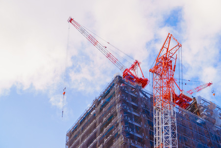 Crane and building construction siteの写真素材