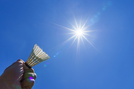 Badminton shuttlecock in the blue sky with sunlightの写真素材