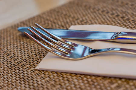 Served fork and knife on table.の写真素材