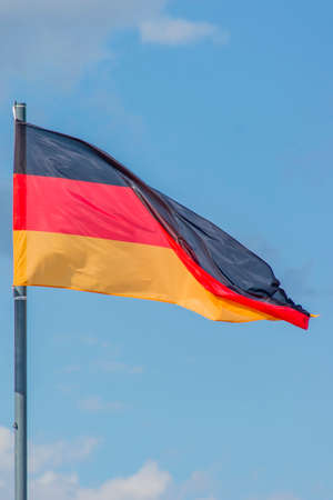 The National flag of Germany flay over the blue skyの写真素材