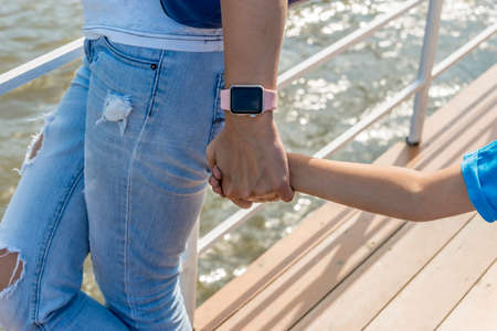 Close up, Mother holding a hand of her sonの写真素材