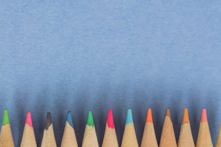 color pencils on blue background
