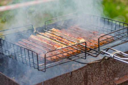 barbeque sausages outdoorsの写真素材