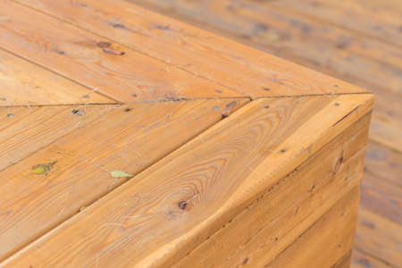 wooden background with fallen leaves