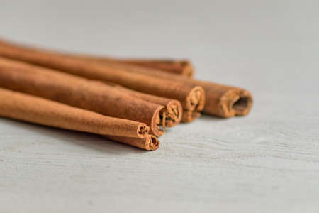 cinnamon sticks on wooden table.の写真素材