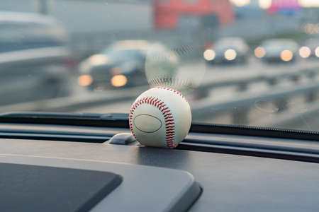 baseball ball in car interiorの写真素材