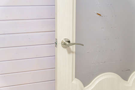 open wood glass doors with lock handle modern styleの写真素材