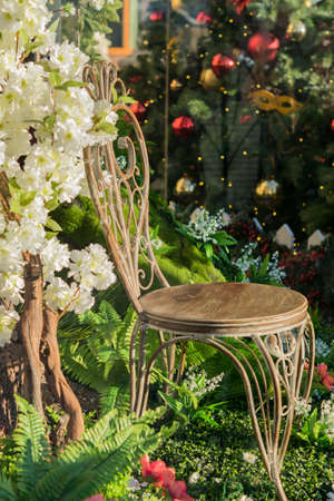 vintage wooden chair in beautiful green garden. Decorative installationの写真素材