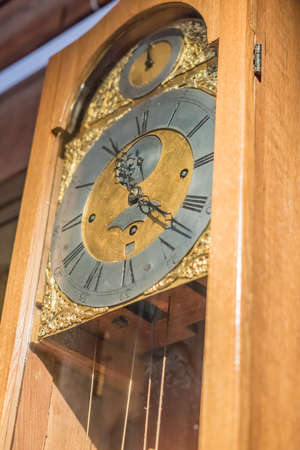 closeup of vintage wooden clock. Selective focus