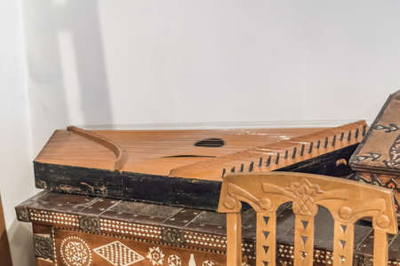 traditional russian music instrument gusli on wooden curved cupboardの写真素材