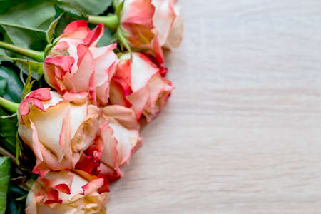  bouquet of roses on wooden table. Floral background with copy spaceの写真素材