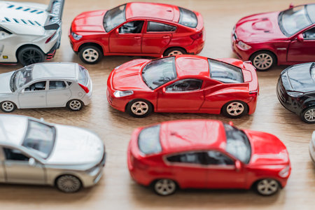 colorful toy car collection on wooden table. selective focusのeditorial素材