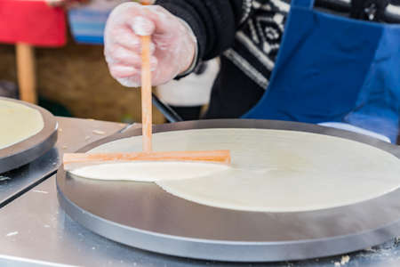 pancake cooked by a street vendorの写真素材