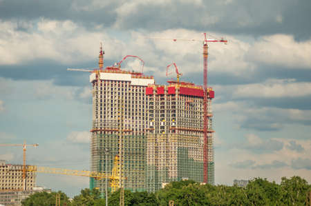 lift cranes building a new residential building