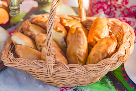 wicker basket with small russian piesの写真素材