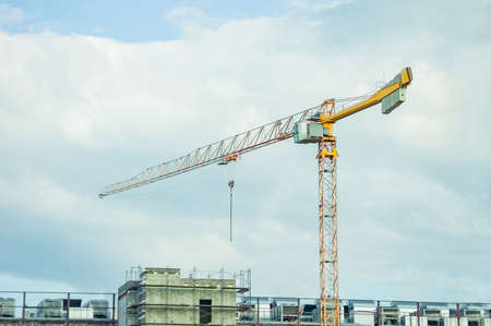 lift crane load stuff to the trucks on the roof of warehouse