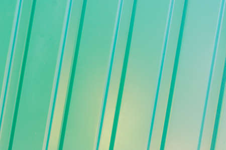abstract background of green matal fenceの写真素材